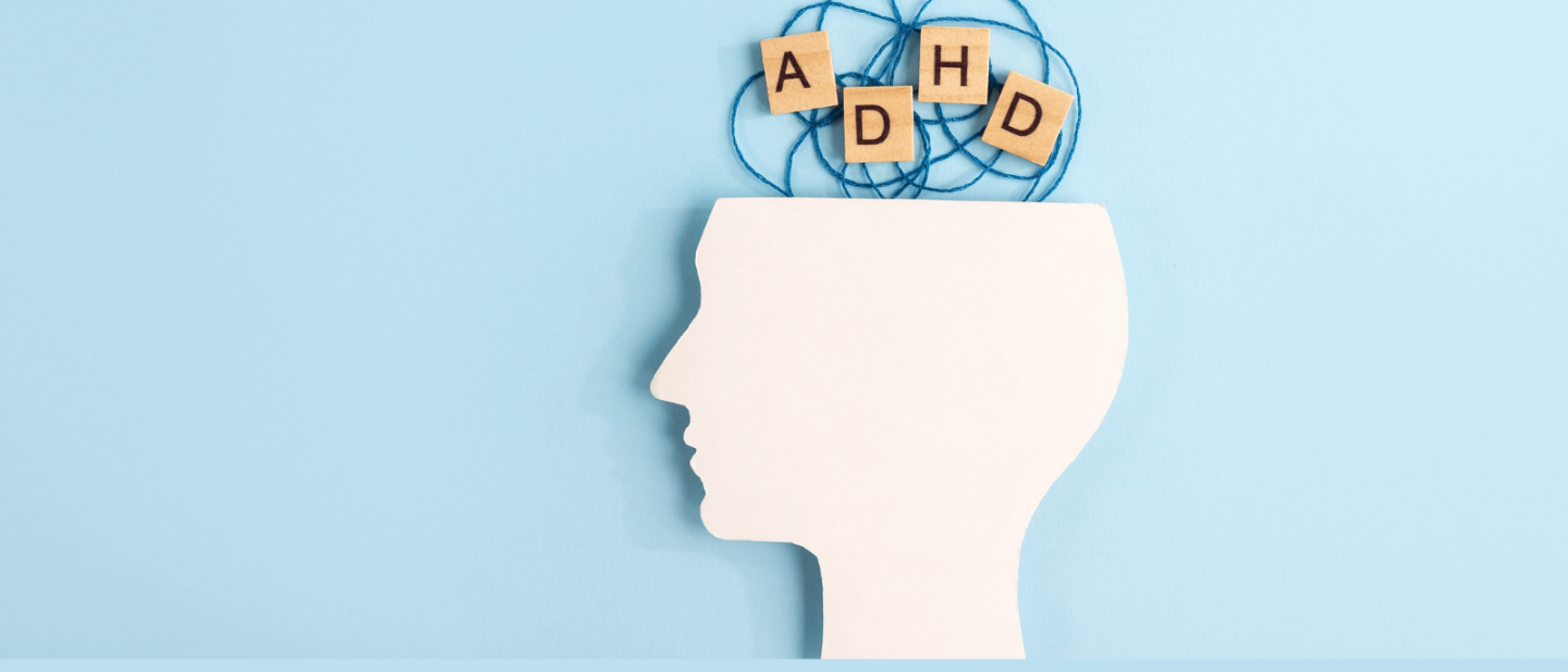 Silhouette of the human head with the letters ADHD at the top.